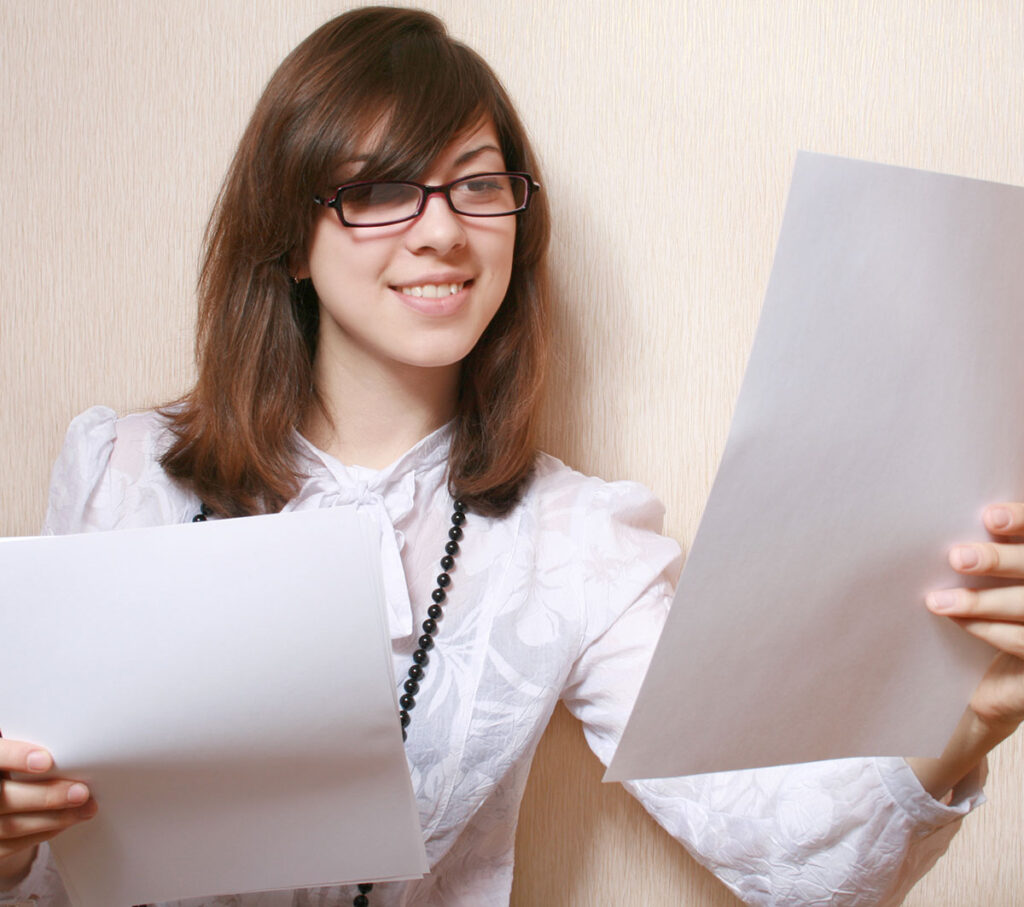Woman comparing her CV to a job advert