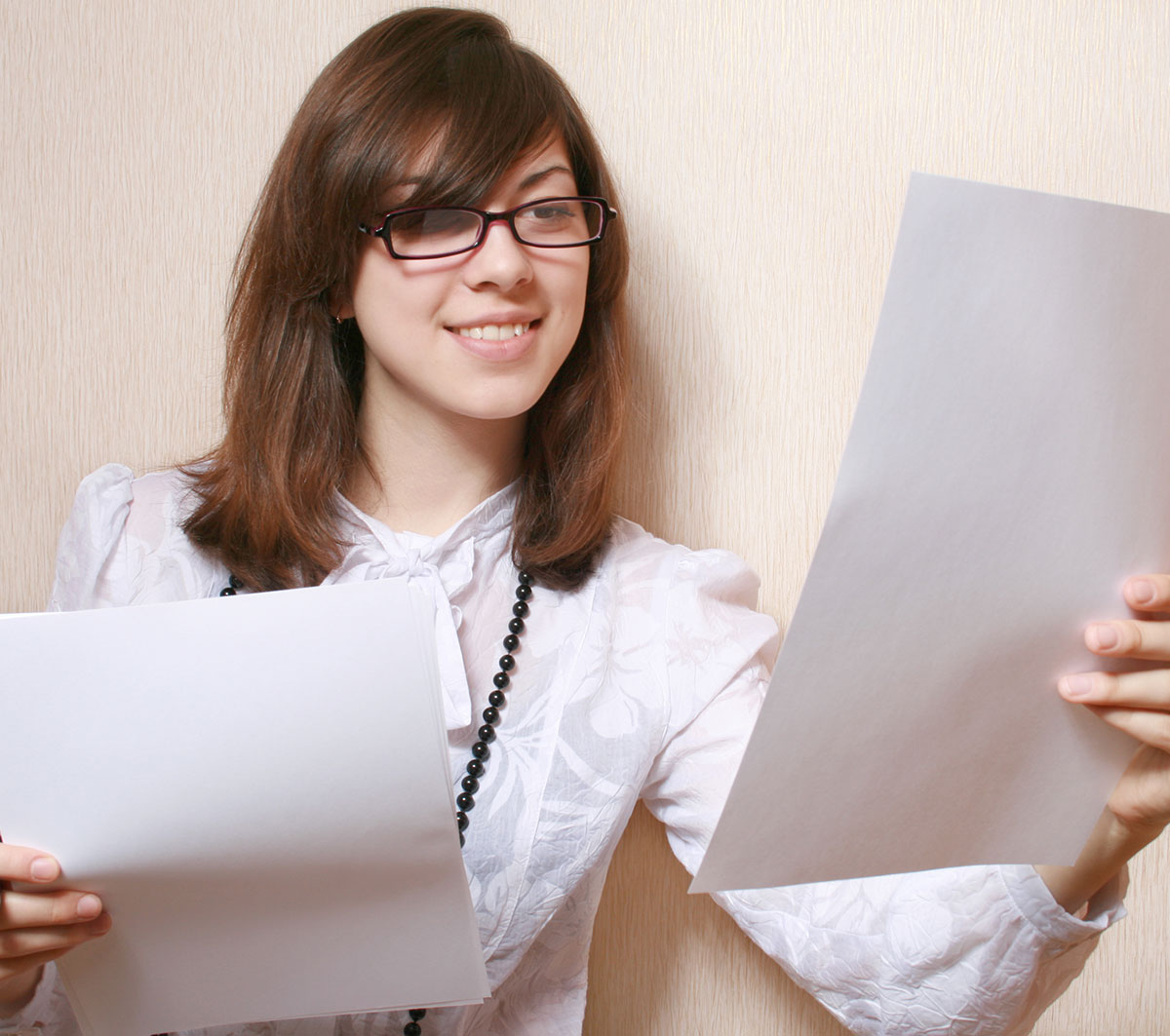 Woman comparing her CV to a job advert