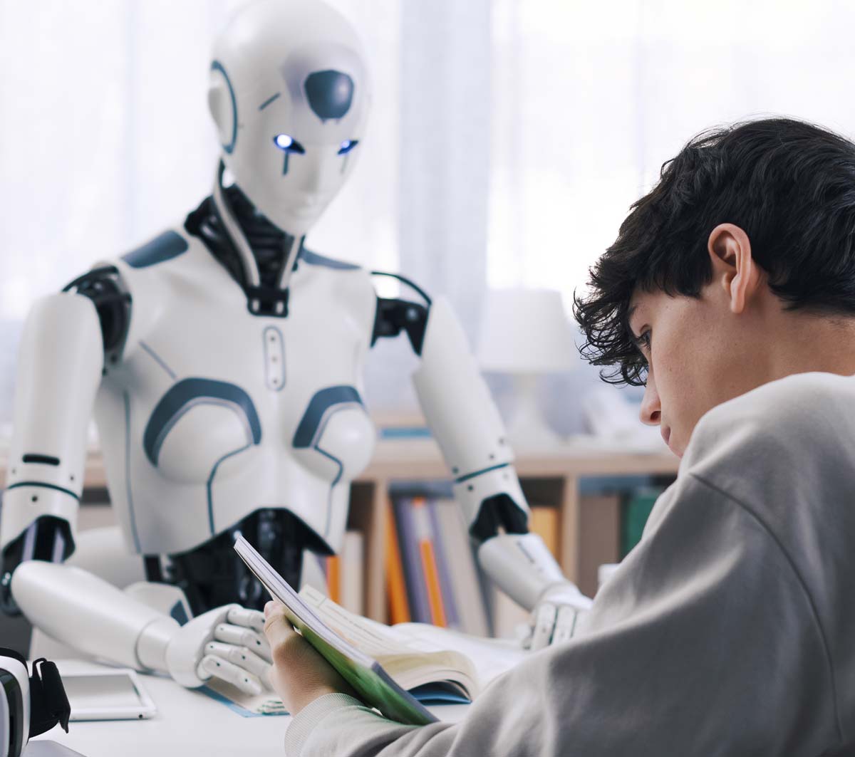 Robot at desk reviewing papers
